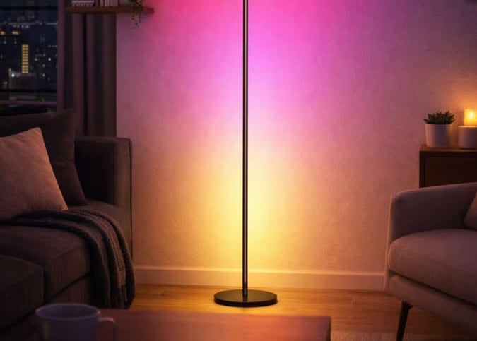Slim LED floor lamp casting colorful ambient light across a modern living room