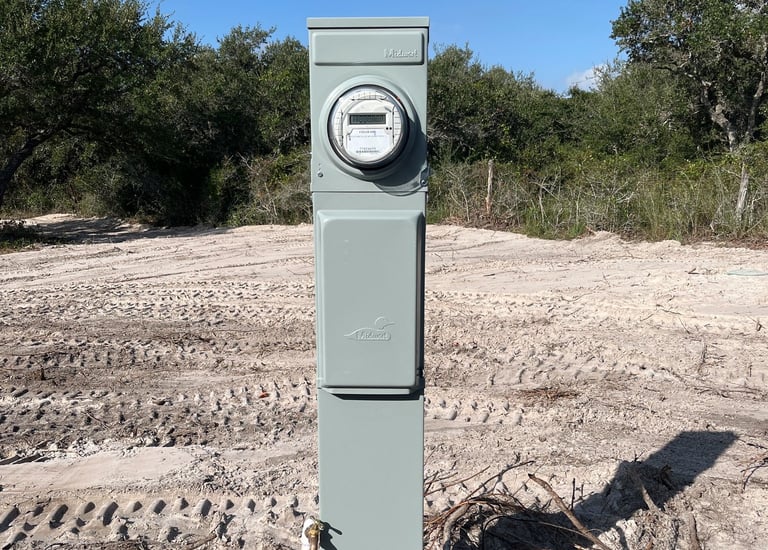 a cleared lot of land with an RV meter installed