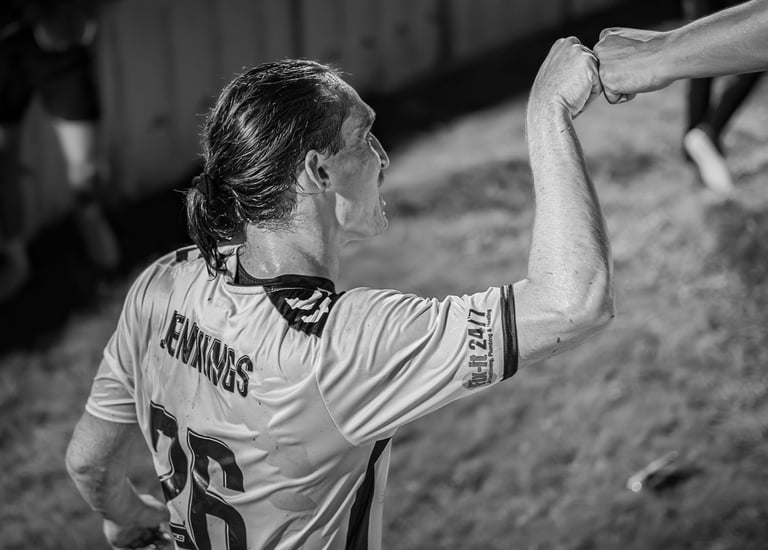 soccer playing giving a fan a pound