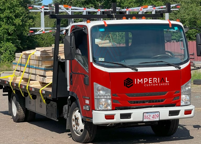 Shed on flatbed truck ready for on-site delivery and setup by Imperial Custom Sheds