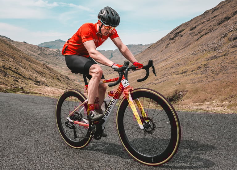 a photo of a road cyclist competing in the fred whitton sportive 
