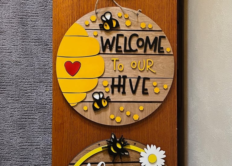 laser cut and colorfully painted wooden door or wall hangers