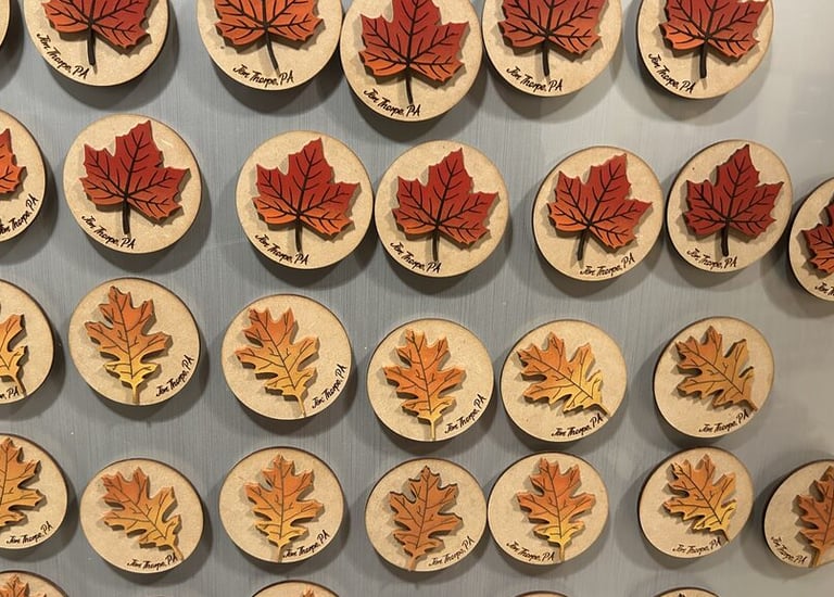 laser engraved and painted fall foliage souvenir magnets