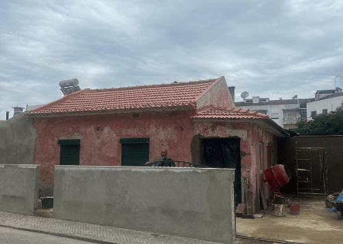 a house with a red roof and a red roof
