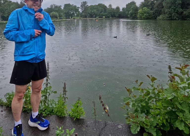 a man in a blue jacket and a red hat