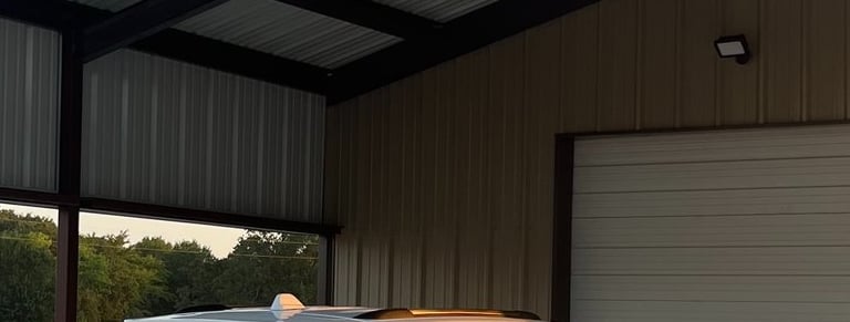 Covered carport with wooden beams.
