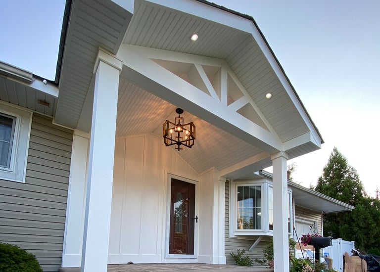 a house with a porch and a light fixture