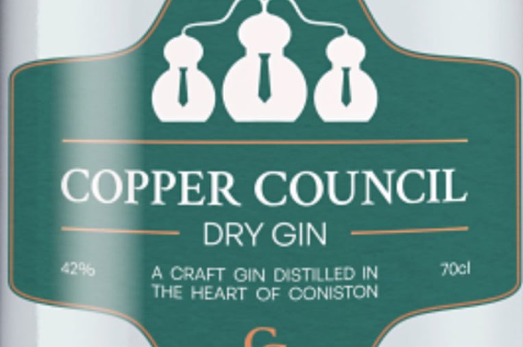 Close up of Copper Council gin bottle on light green background