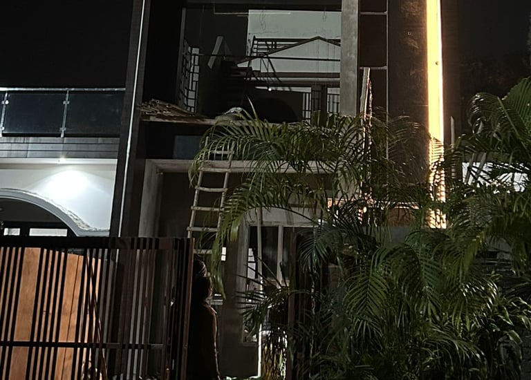 a building with a clock tower in the middle of the night