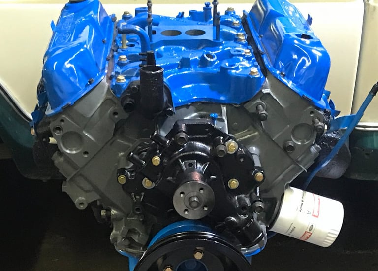 Fully Rebuilt engine with Blue and gray protective paint.