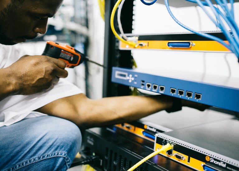 a man in a white shirt is holding a drillet