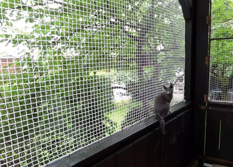 Pet safety net installed around a staircase to keep pets safe indoors.