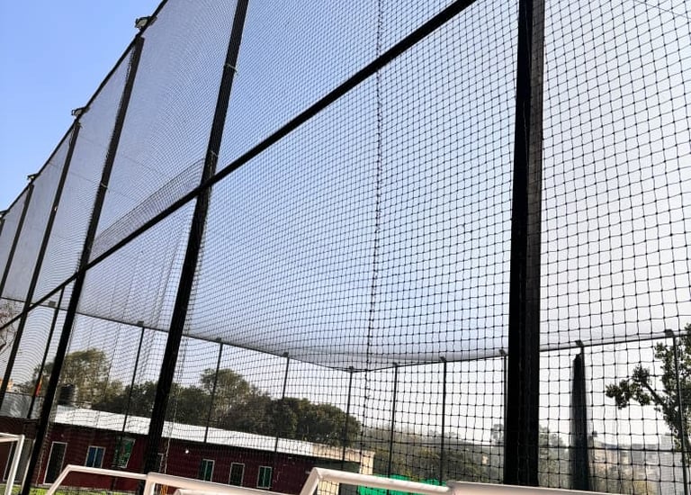 Close-up of strong football nets stretched across a field.