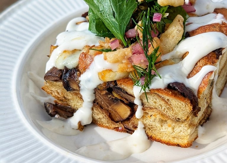 Photo of mushroom and cheesy leek bread pudding with horseradish aioli by Dan Clapson