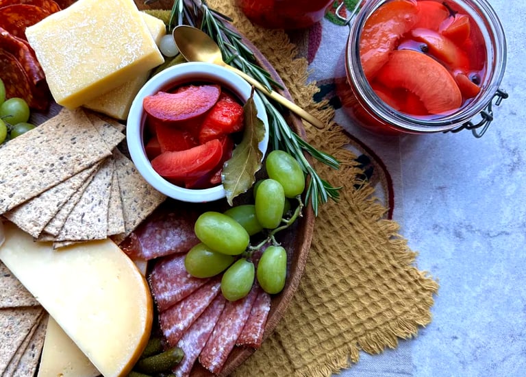 A charcuterie board featuring a pickled stone fruit recipe by Dan Clapson