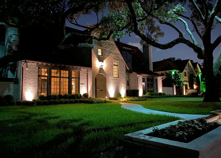 Landscape Lighting front facade of house with a moon light installed in a tree
