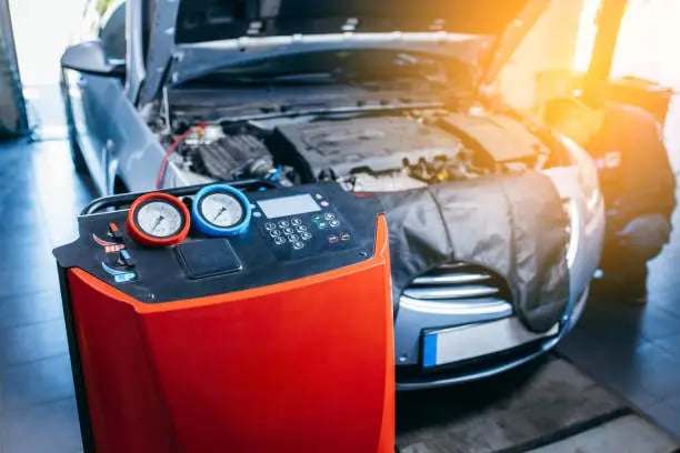 a car with machine that fills the AC
