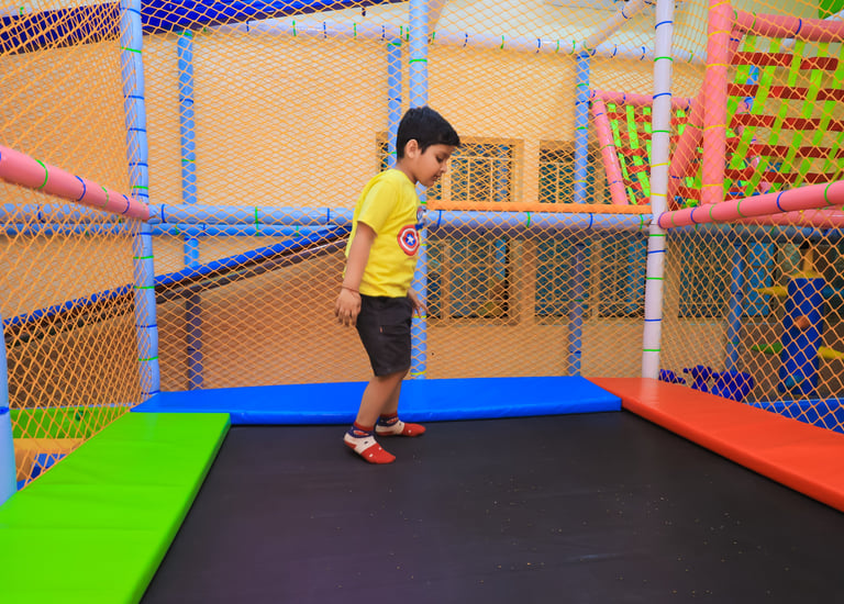 Child jumping on trampoline