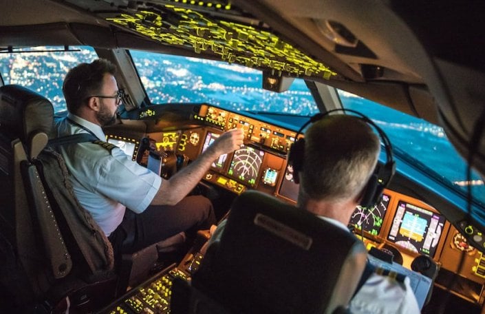 Pilot controling flight in night