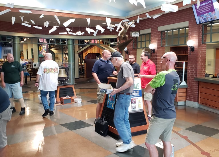 Members displaying models at the Library