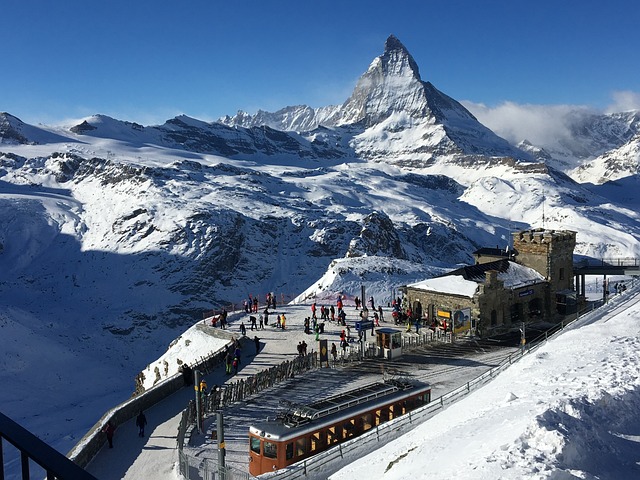 A mountain scene with a train on the tracks, highlighting our private tour experience.