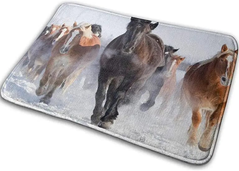 a herd of horses running in the snow