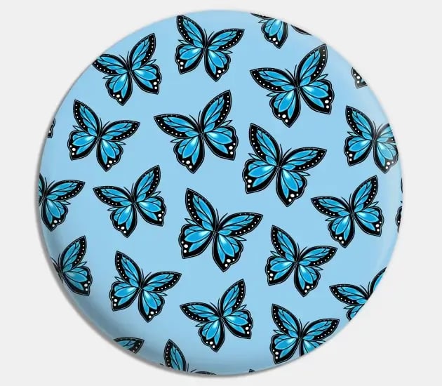 a blue and white plate with a blue butterfly