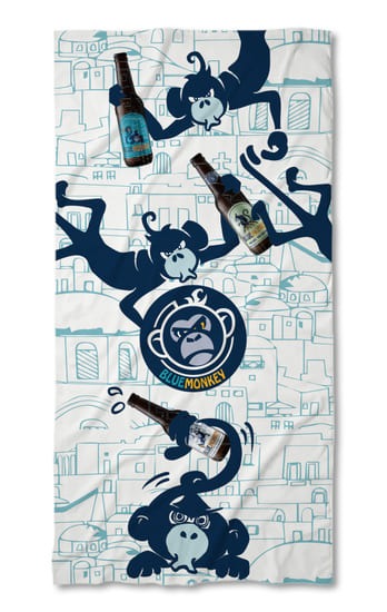 a towel with a monkey on it and a bottle of beer
