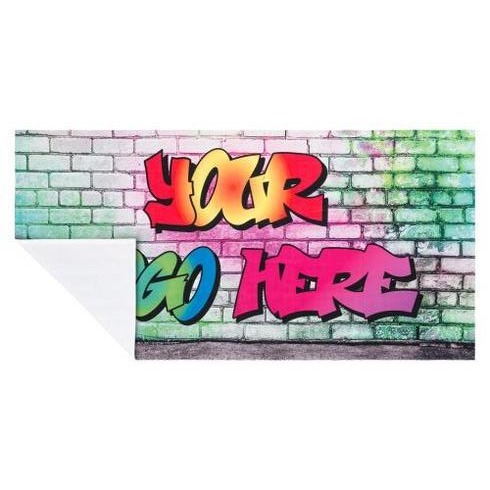 a colorful graffiti - style wallpaper featuring a brick wall with a colorful graffiti -
