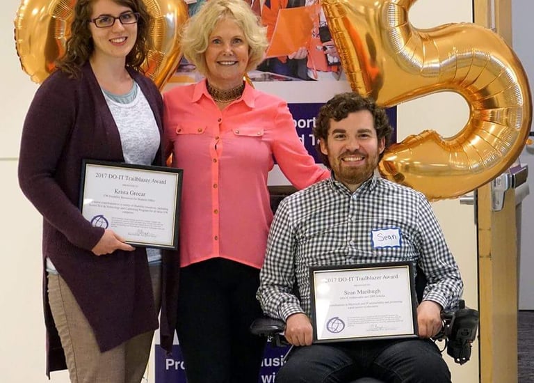 Sean with director of DO-IT and Krista Greerar, both holding a framed 2015 Trailblazer award