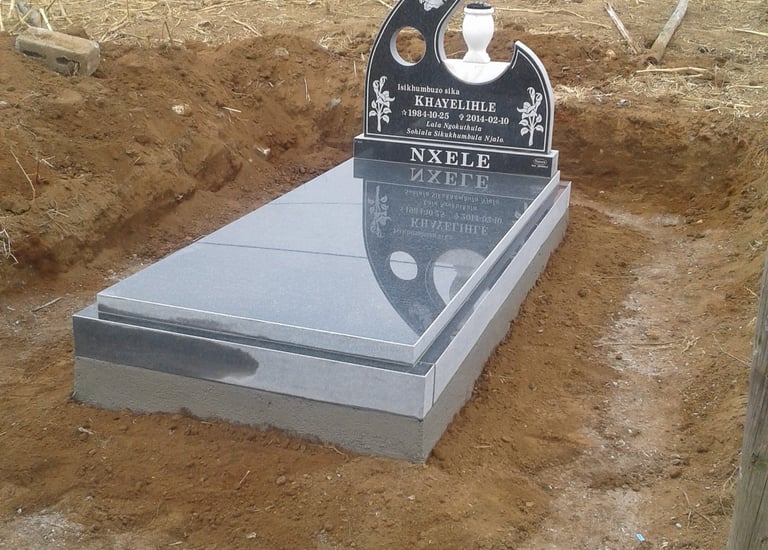 Front view of a Tegg's T19 headstone fitted with a slab