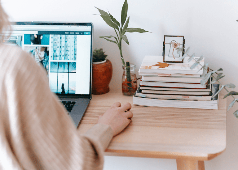 Image of a woman at her laptop working from home
