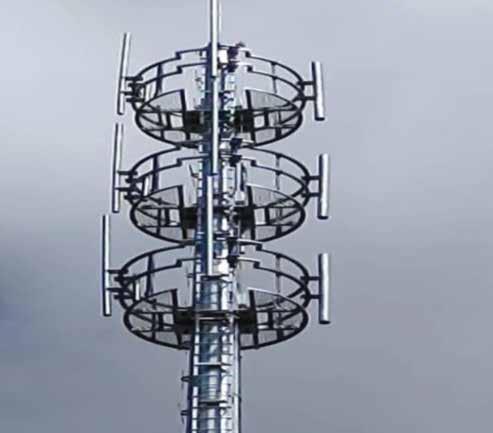 a cell phone tower with a sky background