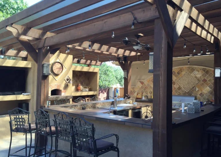 a kitchen with a bar stool and a bar stool