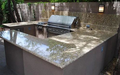 a kitchen island with a grill and a grill