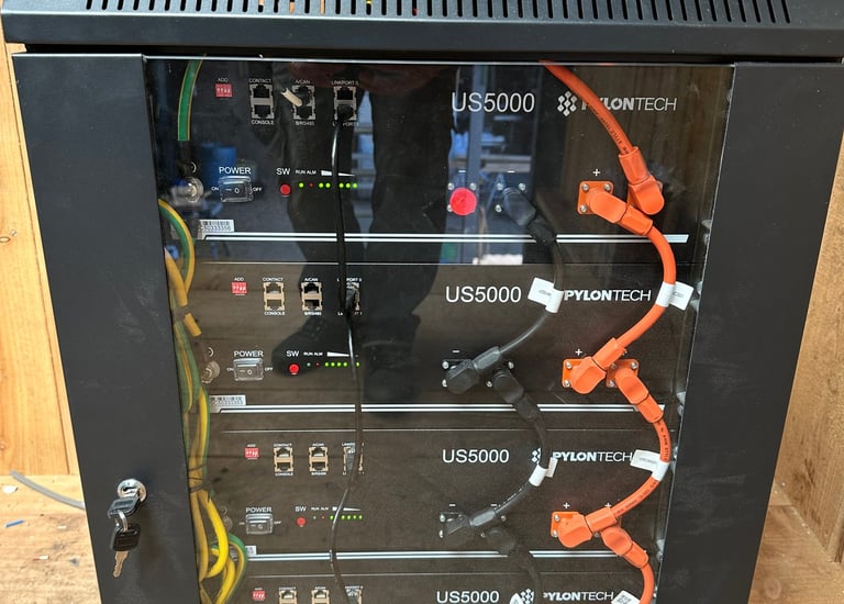 Pylontech US5000 lithium batteries in a cabinet