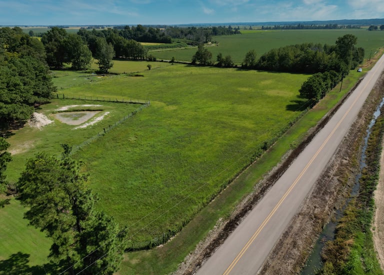 Photo of a property bordering the road. 