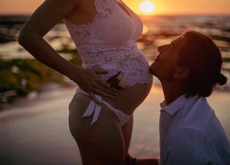 a pregnant woman is standing in front of a man