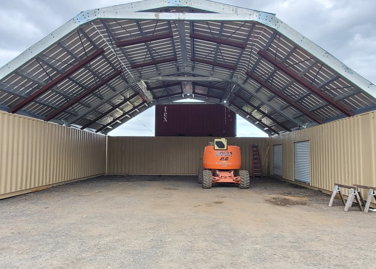 multiple container with large steel roof structure