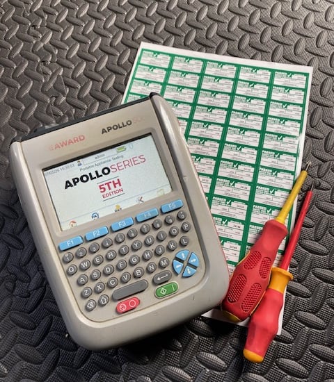 a multi-tester with labels and screwdrivers