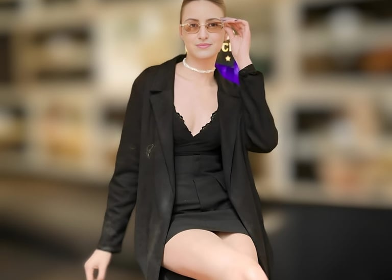 a woman in a black dress and a black jacket
