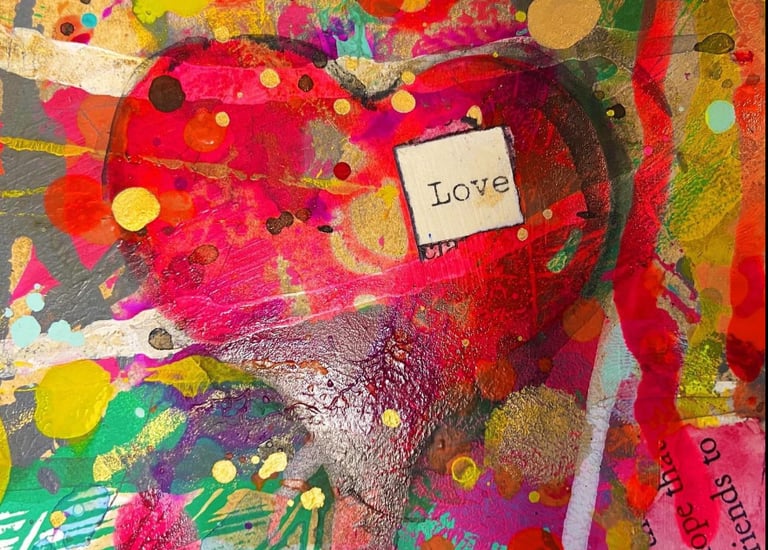 red paper mache heart with love 