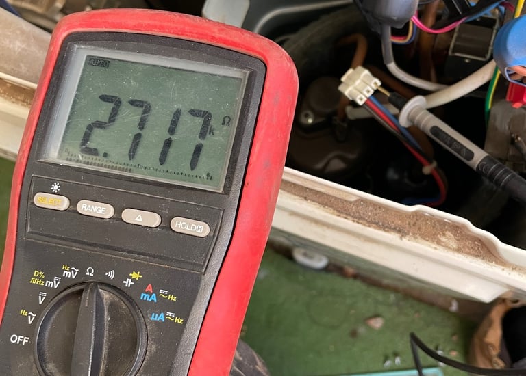 diagnosing split system air conditioner outdoor unit PCB with digital multimeter