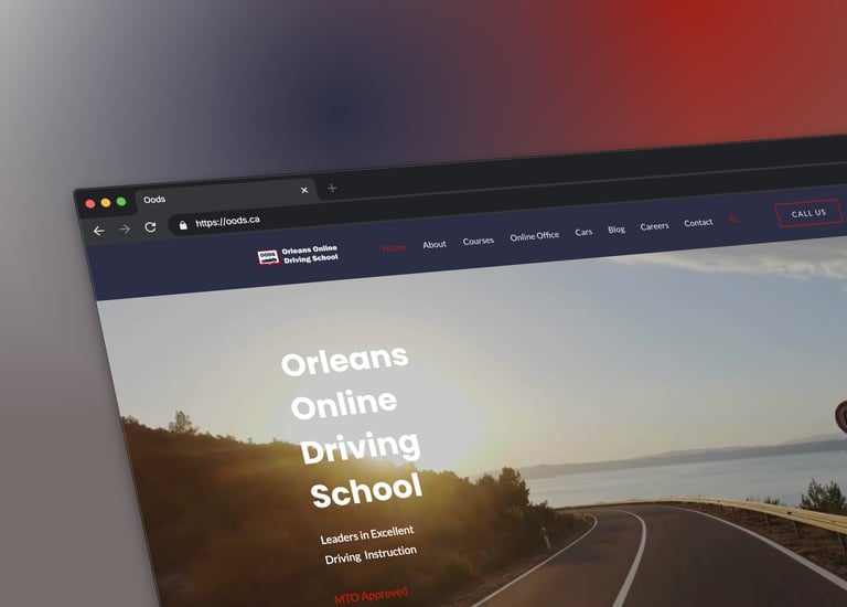 a laptop screen showing a picture of a driving school website page