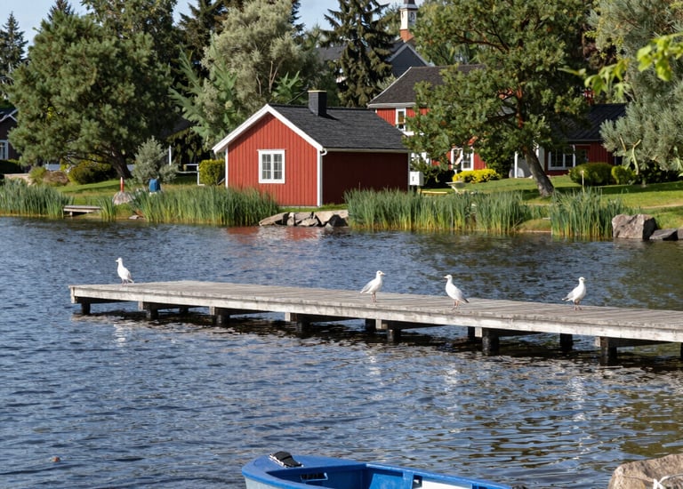 a man riding a skateboard down a street next to tall buildings