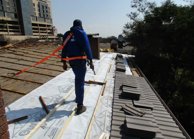 Staff safety harnessed to harness line, safety first, Hyde Park, Sandton
