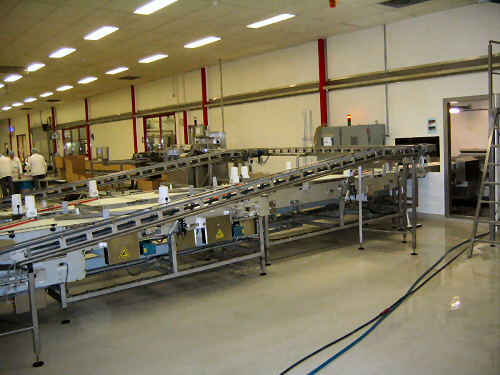 a factory floor with a conveyor belt