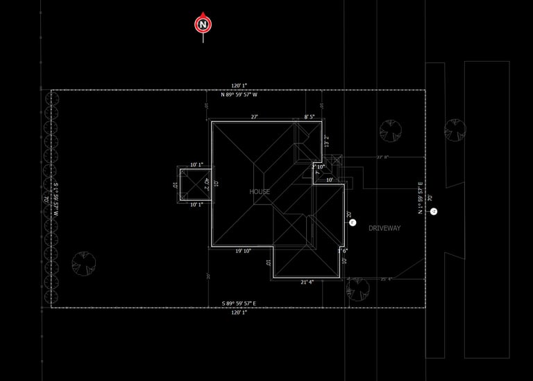 Detailed architectural site plan showing house footprint, driveway, and property dimensions.