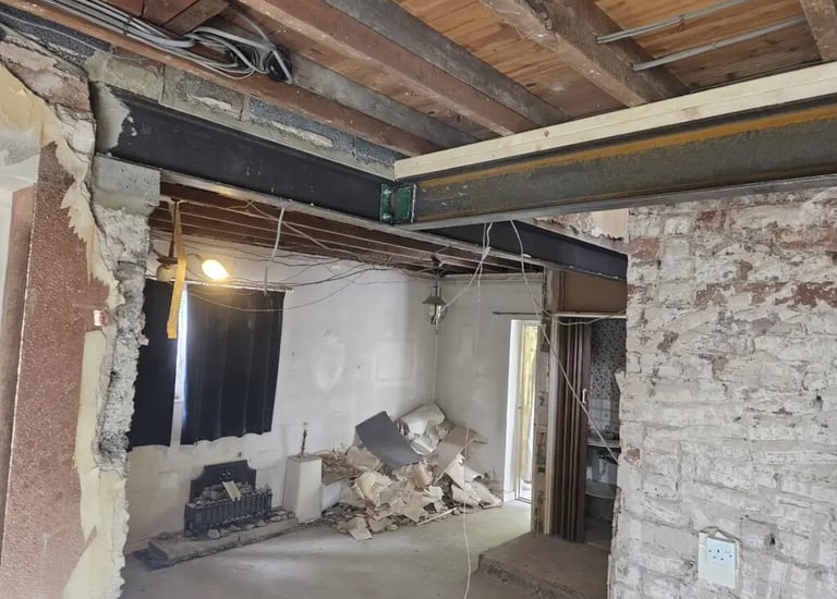 Structural steel RSJ beam installed in a home renovation to support an open plan layout.