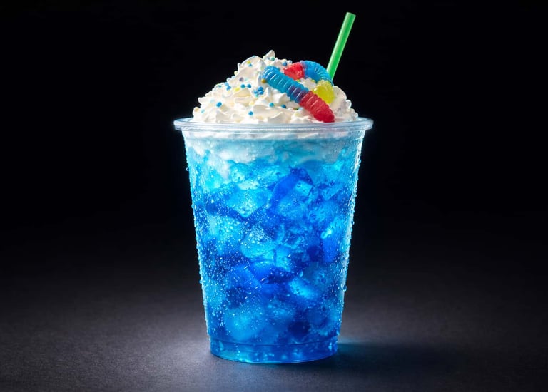 Savage Sodas electric blue energy fusion dirty soda topped with whipped cream and candy